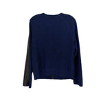 Blue knit jacket with black side panels and ribbed hem