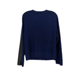 Blue knit jacket with black side panels and ribbed hem
