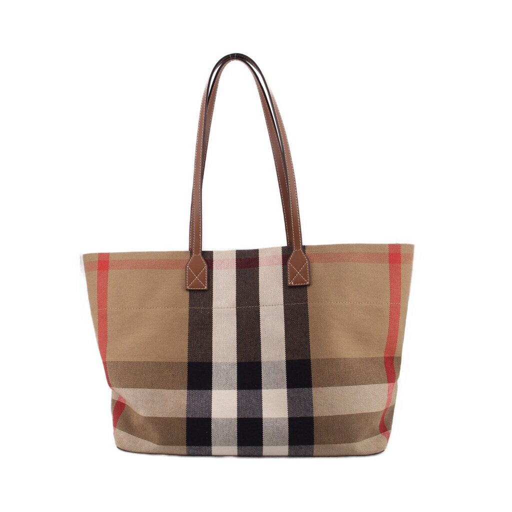 Tote bag with beige, red, and black check canvas and brown leather handles and trim