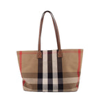 Tote bag with beige, red, and black check canvas and brown leather handles and trim