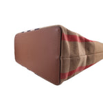 Tote bag end view with brown leather base panel and beige check canvas with red stripes