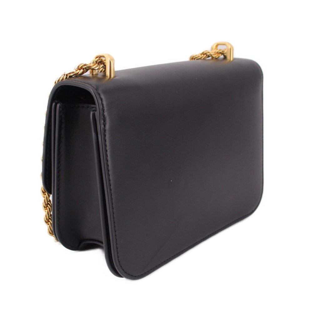 Black leather crossbody bag with braided chain strap and curved flap