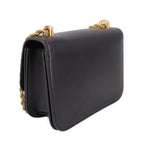 Black leather crossbody bag with braided chain strap and curved flap