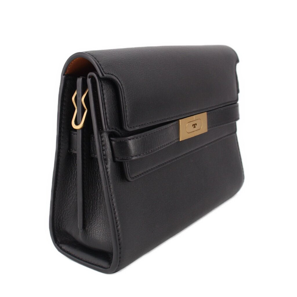 Black leather shoulder bag side view with front flap and gold-toned logo tab