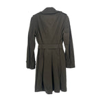Women's dark trench coat, back view, belted waist and pleated skirt