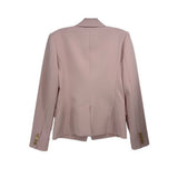 Pink double-breasted blazer back view with tailored seams and vented hem