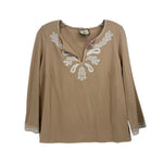 Tan embroidered peasant-style top with three-quarter sleeves and scoop neckline