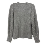 Back of the gray ribbed sweater, with pearl accents along the sleeves