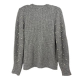 Back of the gray ribbed sweater, with pearl accents along the sleeves