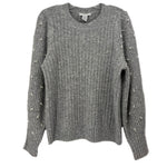 Gray ribbed sweater with a crew neck and pearl accents along the sleeves