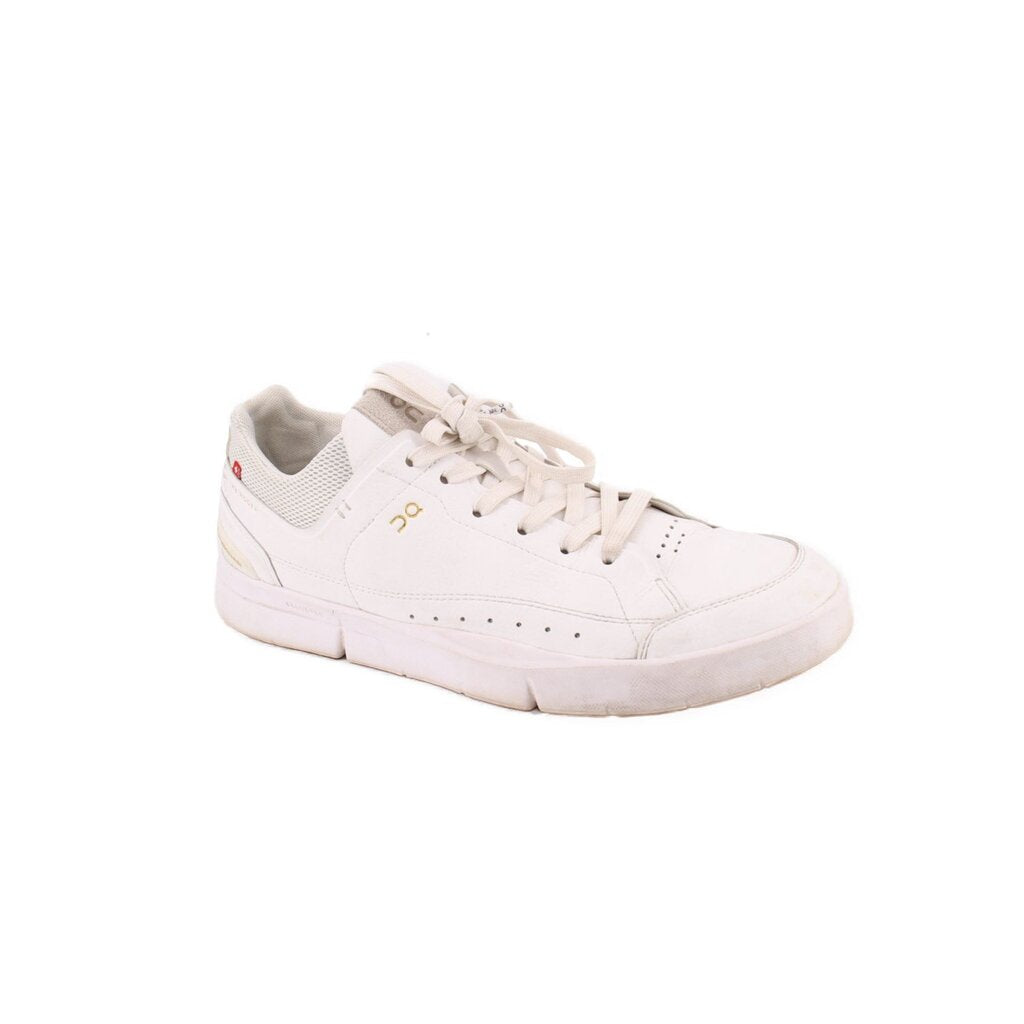 White low-top sneakers with lace-up front, perforated detailing, and rubber cupsole