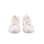 Pair of white lace-up sneakers, front view with small perforations and flat sole