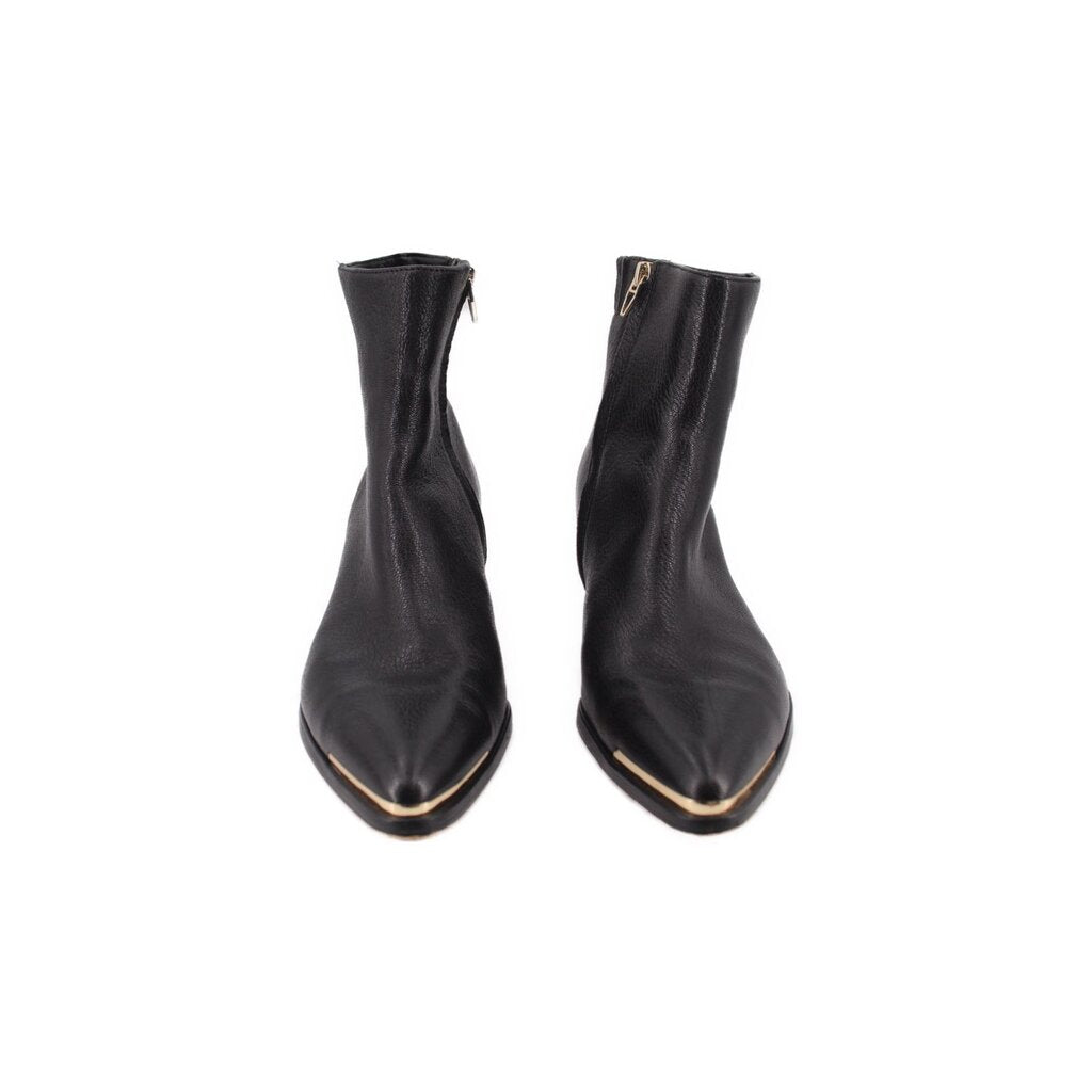 Pair of black leather ankle booties with pointed toe and block heel