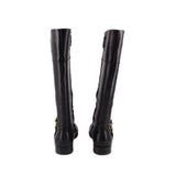 Black knee-high leather boots from back view with gold side buckle