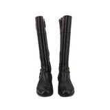 Black knee-high leather boots, pair view with gold buckle accents