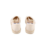 Mary Jane flats showing cream knit back and gold strap detail, blue lining