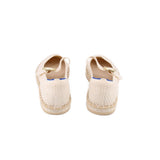 Mary Jane flats showing cream knit back and gold strap detail, blue lining