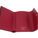 Louis Vuitton Victorine wallet interior in red with card slots and brand mark text