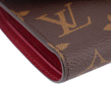 Louis Vuitton Victorine monogram wallet edge close-up with red interior lining and stitching