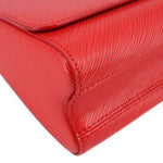 Twist MM crossbody bag corner detail in red textured leather with stitching