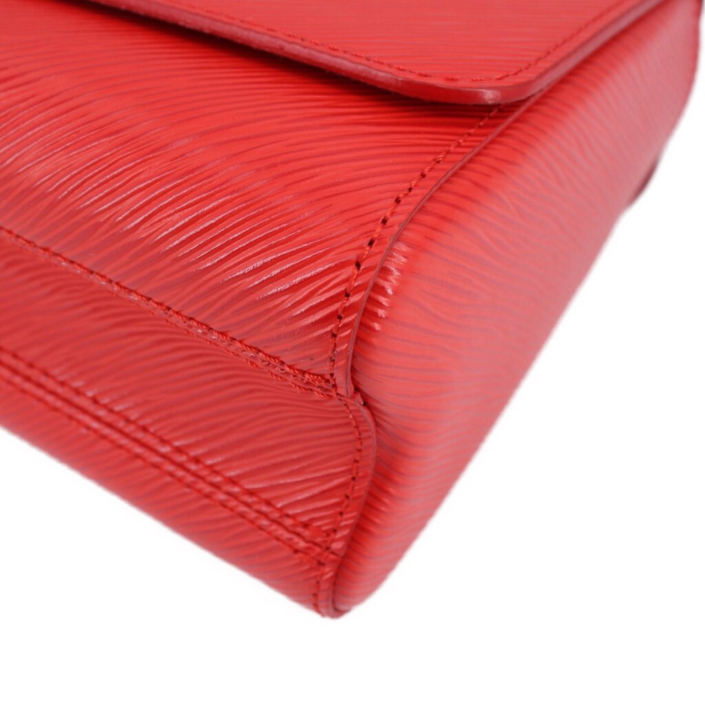 Twist MM crossbody bag close-up corner with red textured finish and stitching