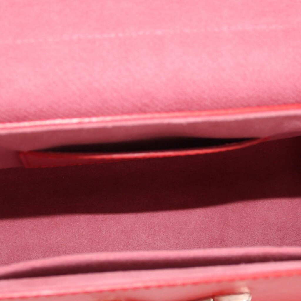 Twist MM crossbody bag interior view with red lining