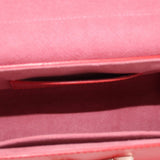 Twist MM crossbody bag interior view with red lining