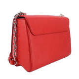 Twist MM crossbody bag in red textured leather with chain strap and flap
