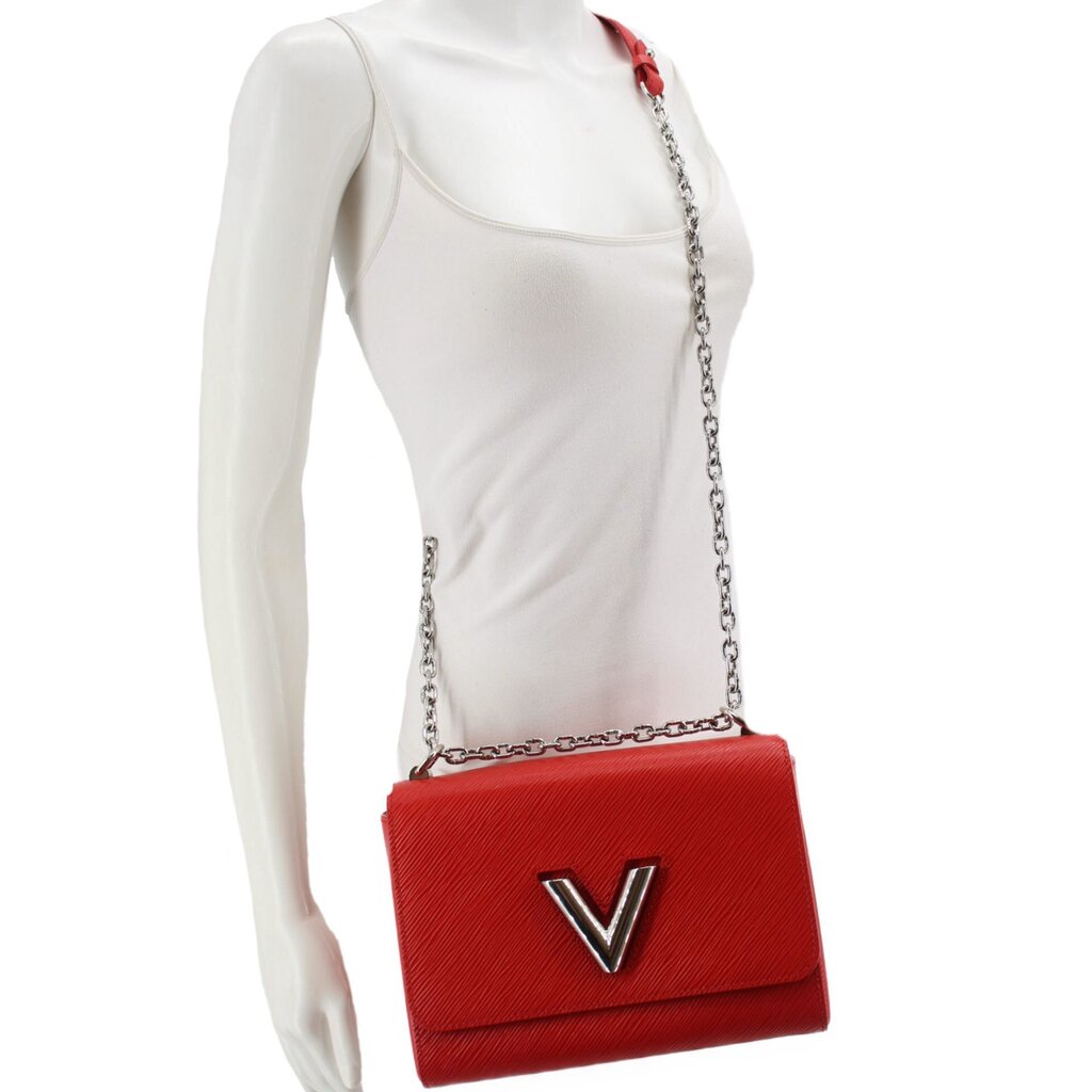 Twist MM crossbody bag on mannequin in red textured leather with LV emblem