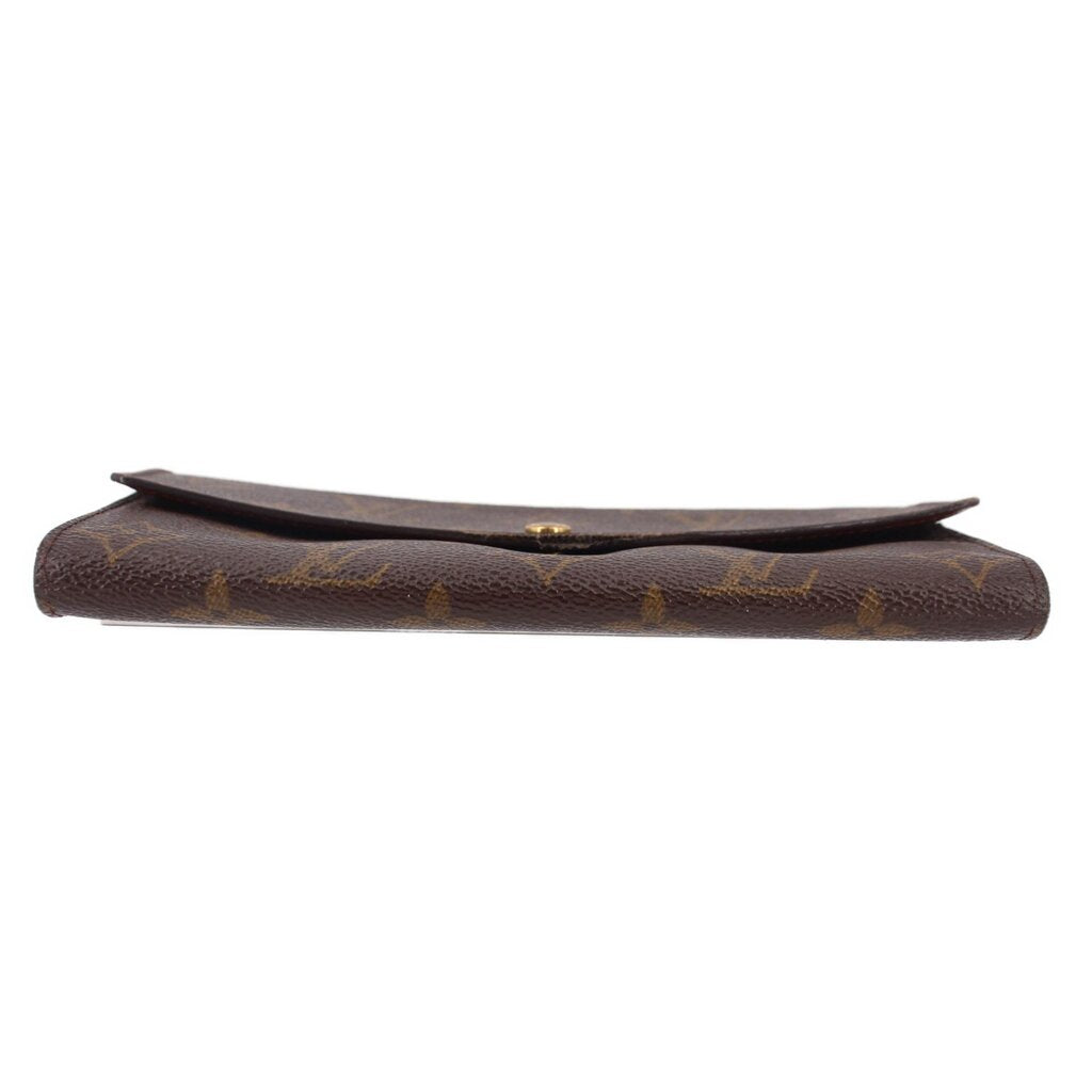 Louis Vuitton monogram wallet profile with raised edge and snap