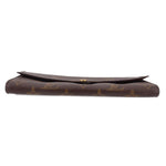 Louis Vuitton monogram wallet profile with raised edge and snap