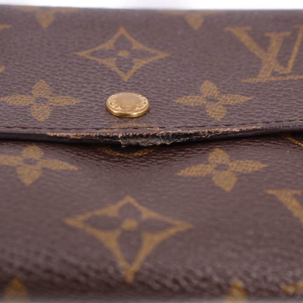 Louis Vuitton monogram wallet snap button detail on monogram canvas