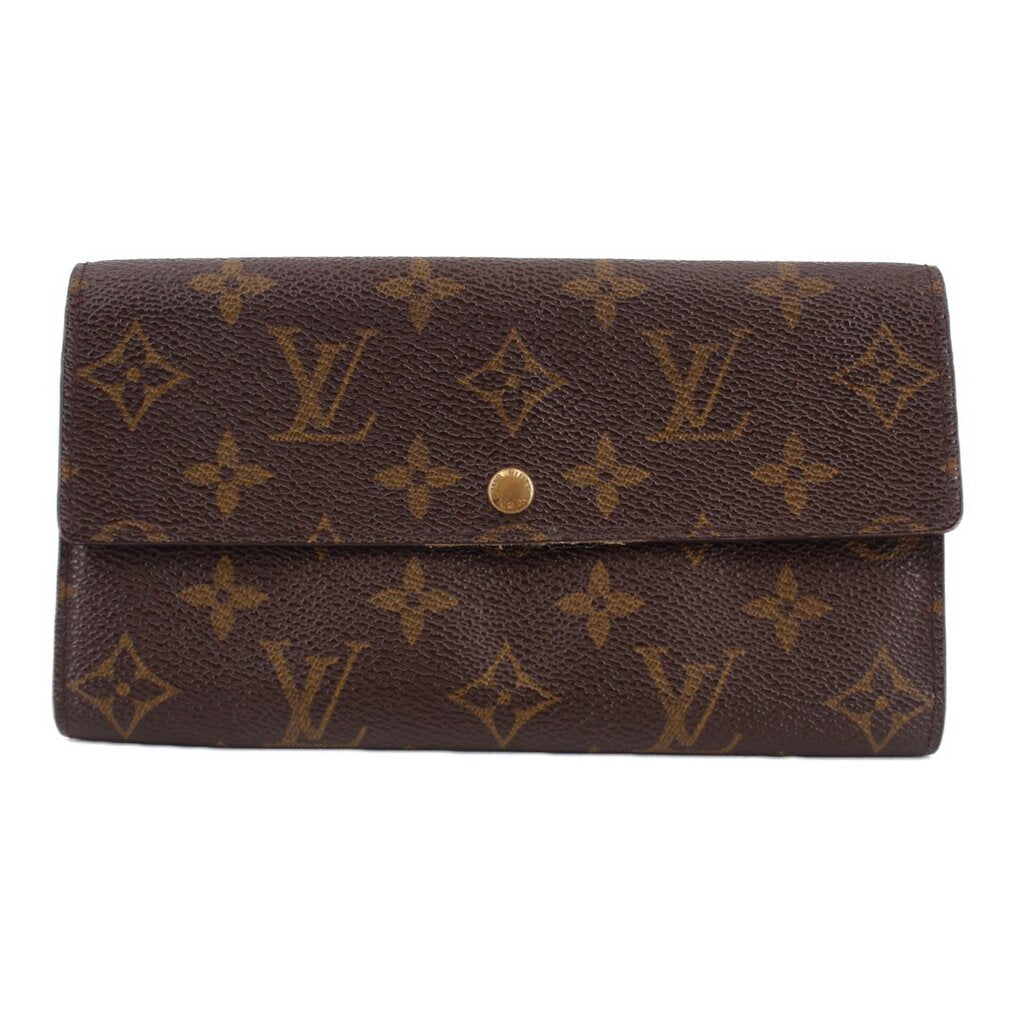 Louis Vuitton monogram flap wallet with gold-tone snap button