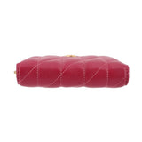 Fuchsia quilted zip wallet top view with gold zipper hardware.
