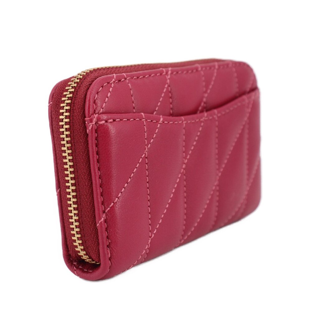 Fuchsia quilted zip wallet side profile with gold zipper hardware.