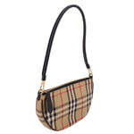 Shoulder bag with vintage check body, black leather strap, and top zip