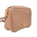 Tan perforated crossbody bag side view with gold zipper pull and ring hardware