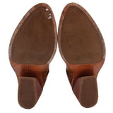 Camel suede-lined boot soles with tread and FRYE heel branding
