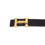 Reversible leather belt, black strap with gold-tone H buckle front