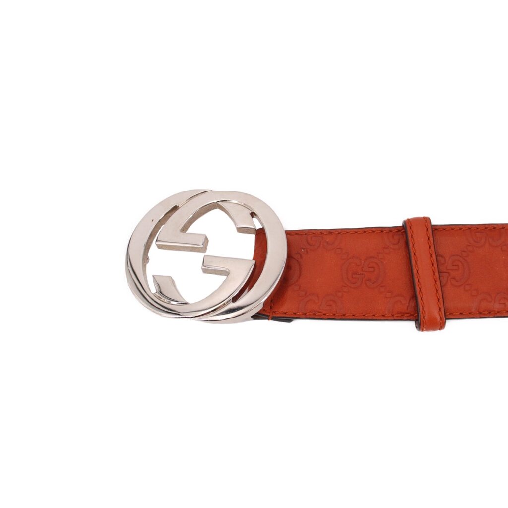 GUCCI interlocking GG belt close-up, rust leather with silver interlocking buckle
