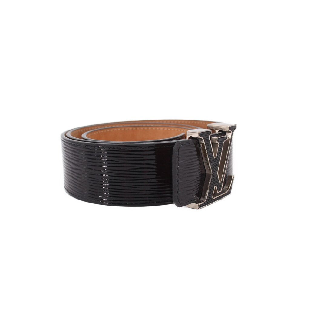 Black leather belt with rectangular silver-tone buckle and tan lining