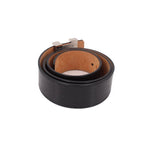 Black leather belt showing inner tan strap and silver buckle hardware