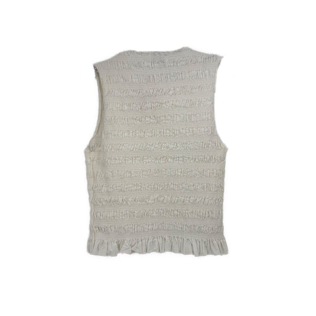 White smocked sleeveless top, back view with ruffled hem