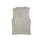 White smocked sleeveless top, back view with ruffled hem