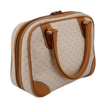 Beige monogram canvas top handle bag with tan leather buckle strap details and zipper top