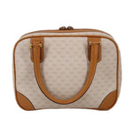 Beige vintage duffel-style top handle bag with tan leather trim and dual top handles