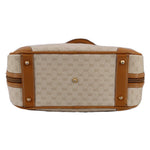 Beige canvas vintage top handle bag with tan leather end panels and gold-tone hardware