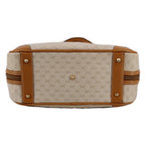 Beige canvas vintage top handle bag with tan leather end panels and gold-tone hardware