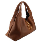 Brown leather maxi shoulder bag with gold clasp and top handles, side view