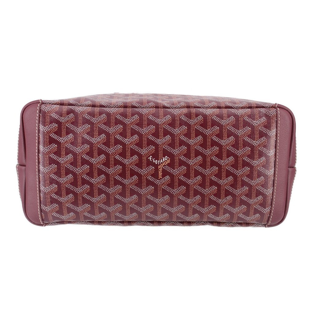 Maroon patterned tote with leather trim and rounded top edge stitching